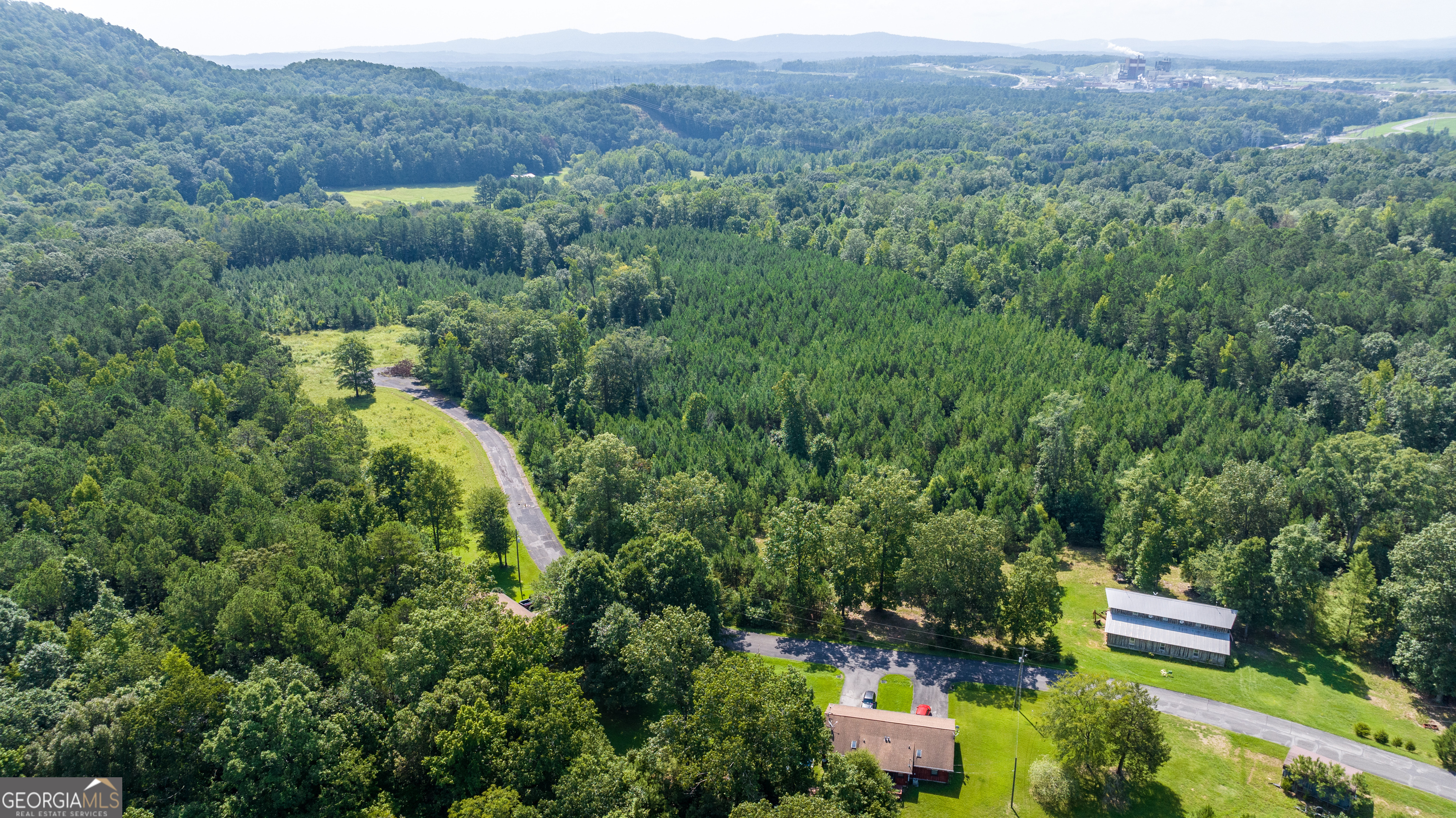 36 Stargazer Trail Northwest Rome, GA 30165 - Photo 61 of 79 a view of a lush green forest with trees and some houses