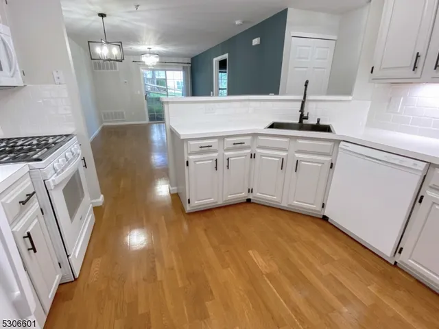 a kitchen with sink cabinets and window