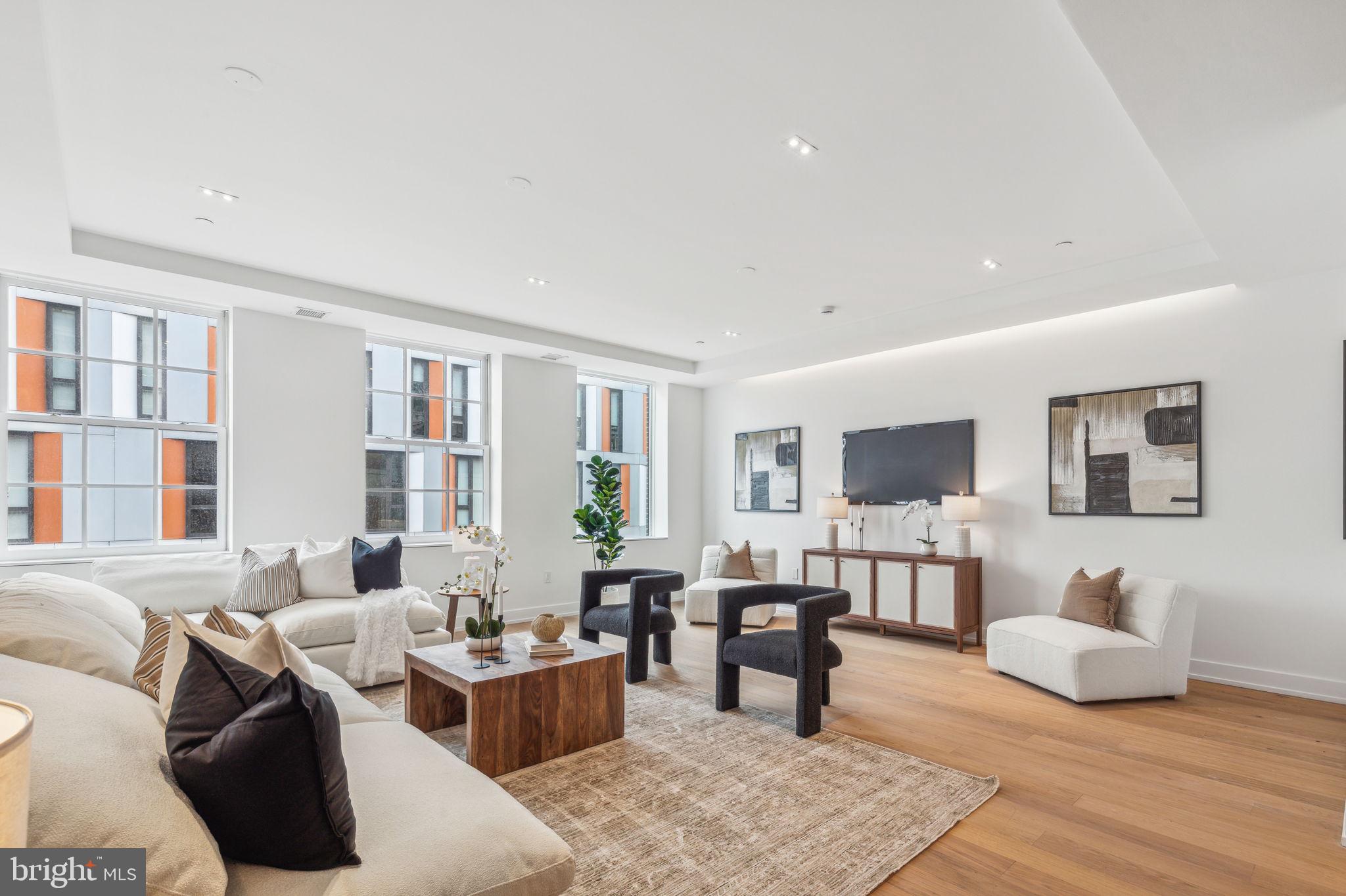 124 North 2nd Street, Unit 4 Philadelphia, PA 19106 - Photo 18 of 48 a living room with furniture and a flat screen tv