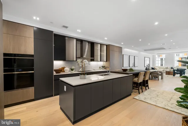 a kitchen with stainless steel appliances granite countertop a stove and a refrigerator