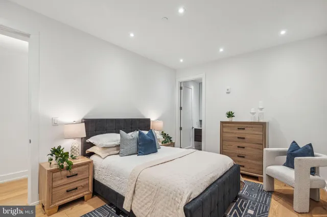 a bedroom with a bed and with furniture