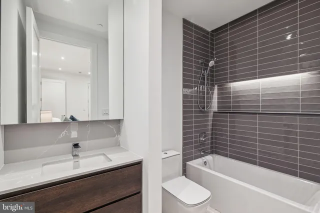 a bathroom with a bathtub and a sink