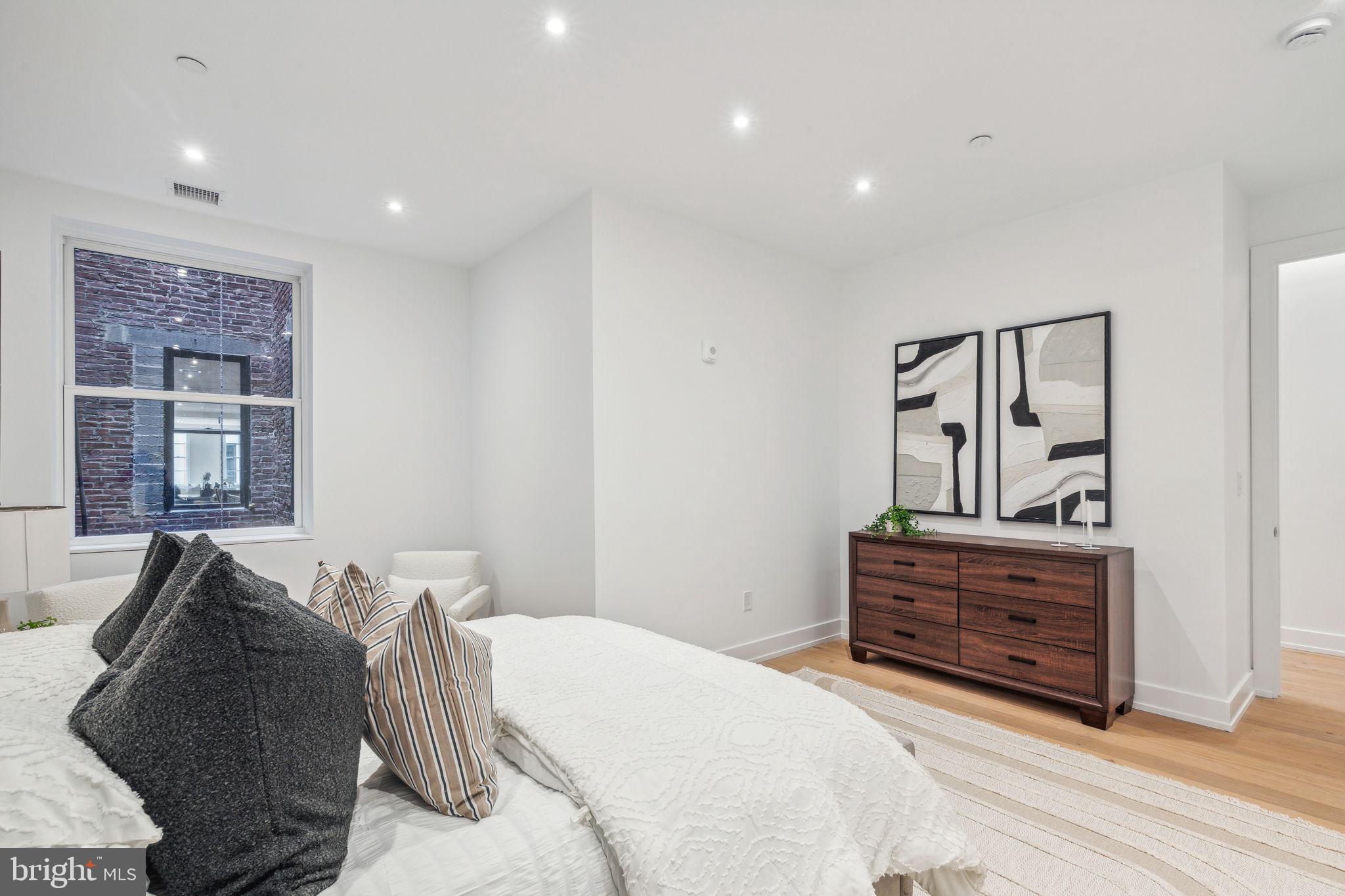 124 North 2nd Street, Unit 4 Philadelphia, PA 19106 - Photo 28 of 48 a bedroom with a bed and a dresser