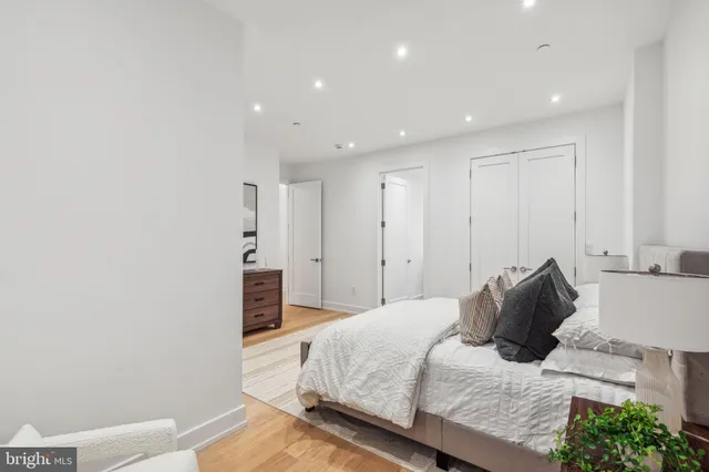 a bedroom with a bed and a couch