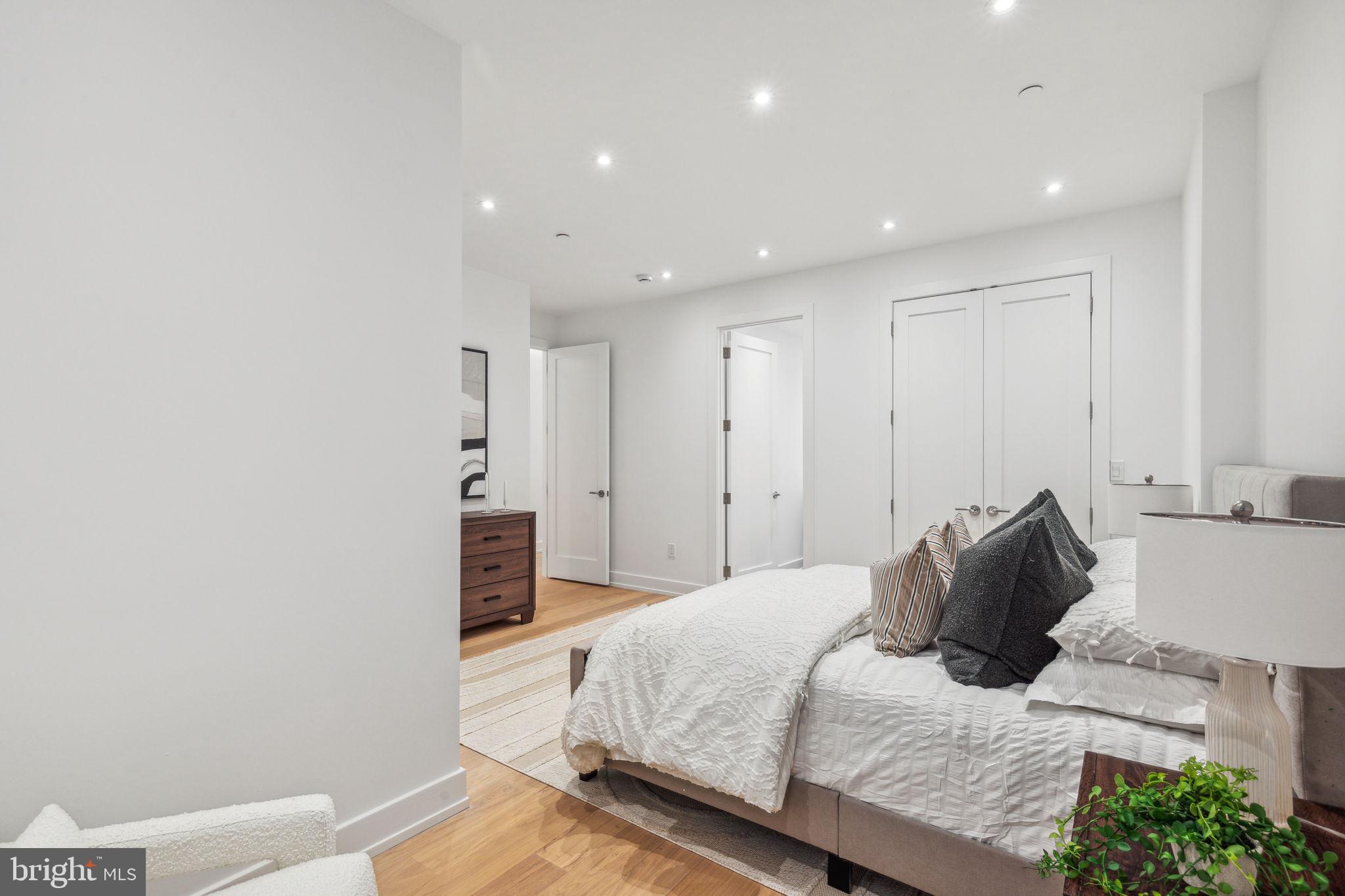 124 North 2nd Street, Unit 4 Philadelphia, PA 19106 - Photo 29 of 48 a bedroom with a bed and a couch