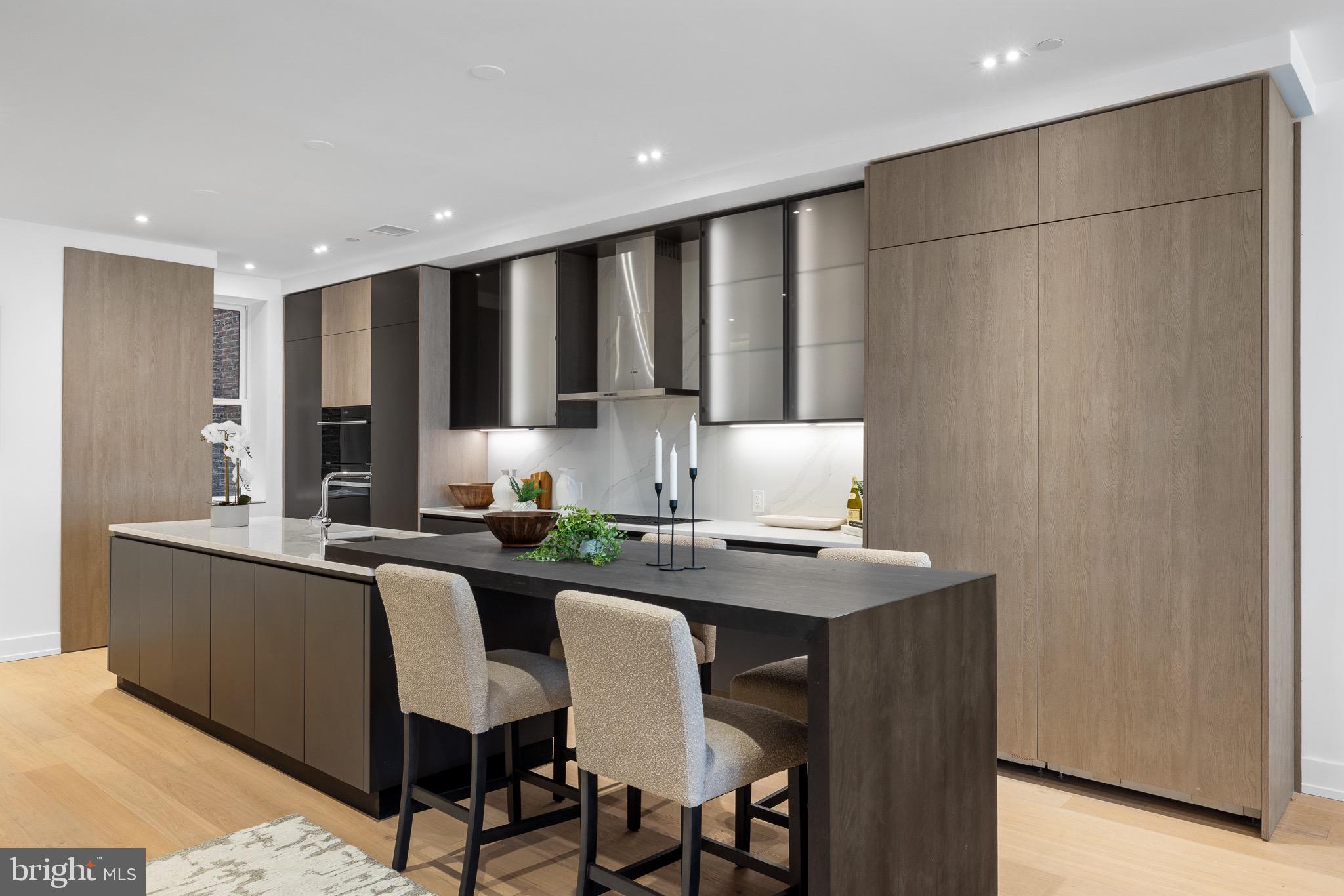 124 North 2nd Street, Unit 4 Philadelphia, PA 19106 - Photo 3 of 48 a kitchen with stainless steel appliances granite countertop a sink and a refrigerator