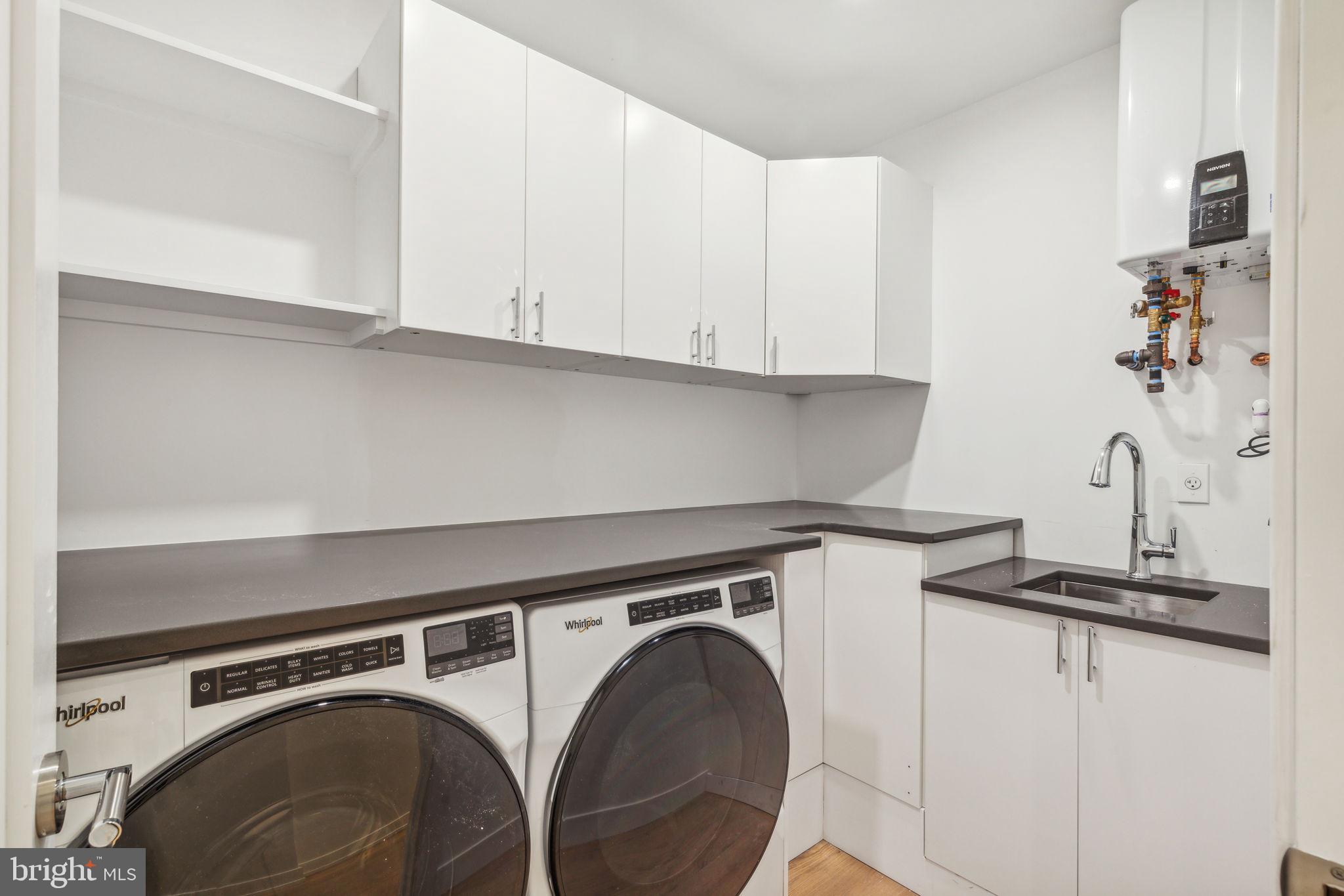 124 North 2nd Street, Unit 4 Philadelphia, PA 19106 - Photo 33 of 48 a utility room with dryer and washer