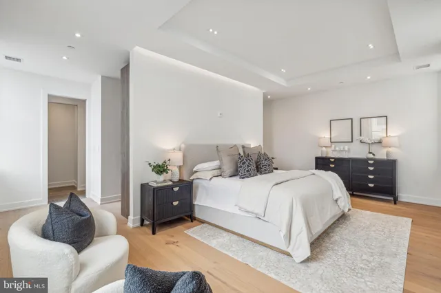 a bedroom with a bed and a couch