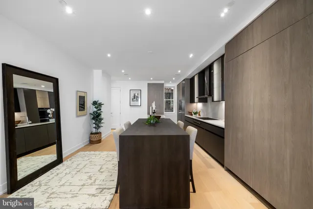 a kitchen with refrigerator and stove