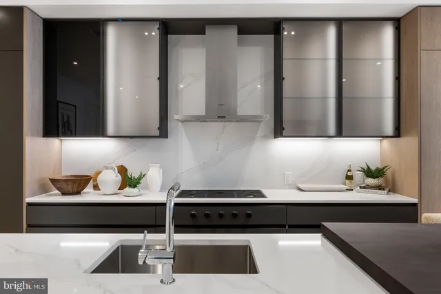 a kitchen with a sink and cabinets