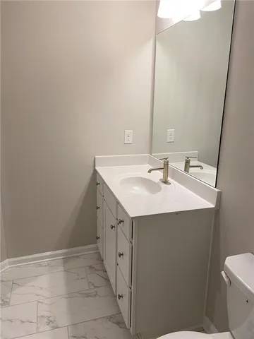 a bathroom with a sink and mirror
