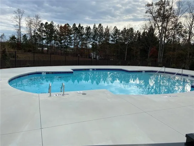 a view of a fountain in the backyard of a house