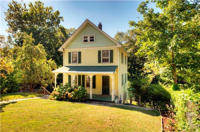 28 Riversville Road Greenwich, CT 06831 - Photo 1 of 1 a front view of a house with a yard