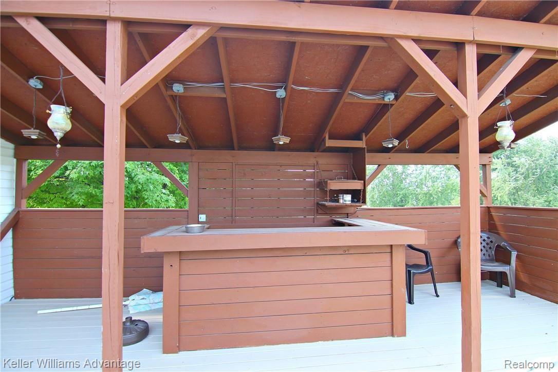 7171 North Fowlerville Road Fowlerville, MI 48836 - Photo 18 of 23 jFowlerville Rd Back Deck 3.jpg