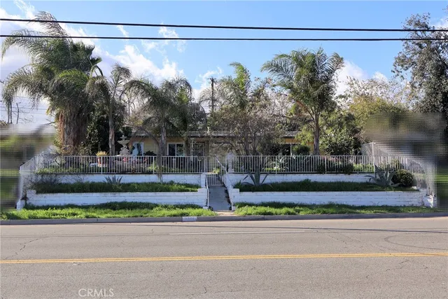 a view of a yard with a street sign