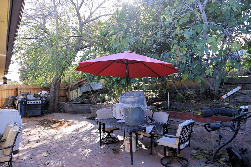 1261 North Rancho Avenue Colton, CA 92324 - Photo 12 of 27 a view of backyard with outdoor seating and trees