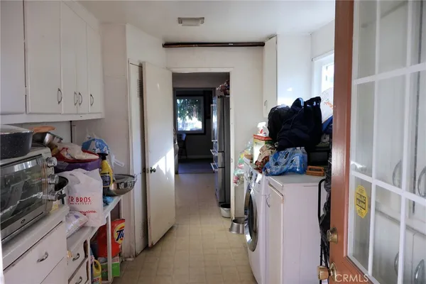 a kitchen with stainless steel appliances a sink stove and refrigerator