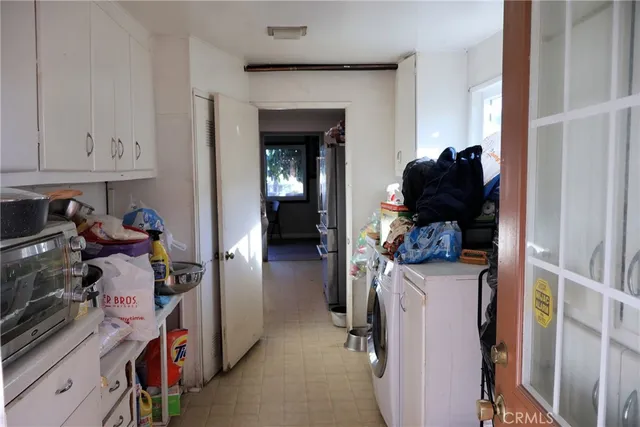 a kitchen with stainless steel appliances a sink stove and refrigerator