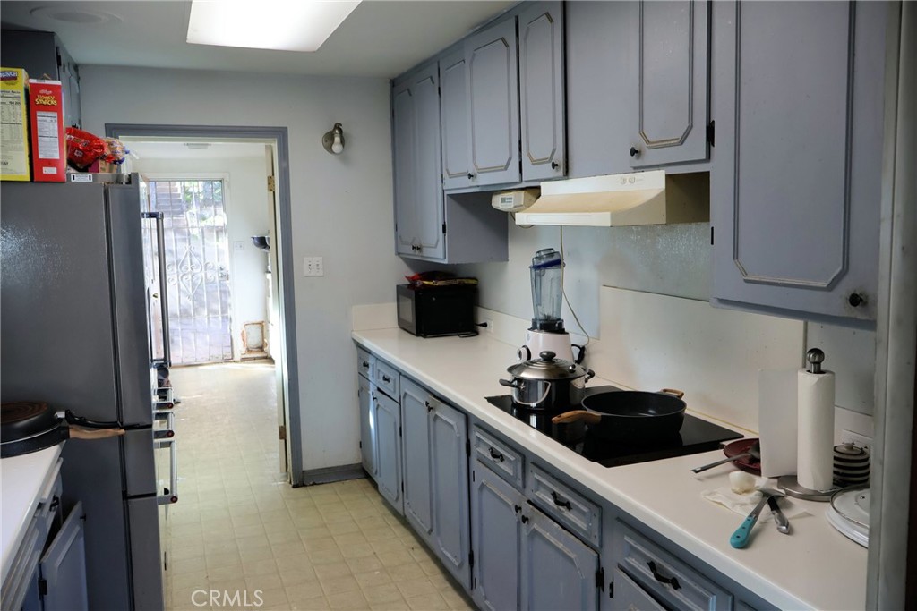 1261 North Rancho Avenue Colton, CA 92324 - Photo 16 of 27 a kitchen with stainless steel appliances a sink stove and refrigerator