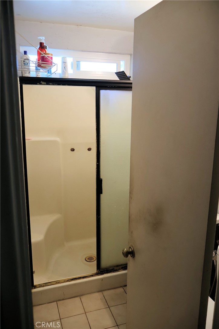 1261 North Rancho Avenue Colton, CA 92324 - Photo 21 of 27 a bathroom with a shower and a sink