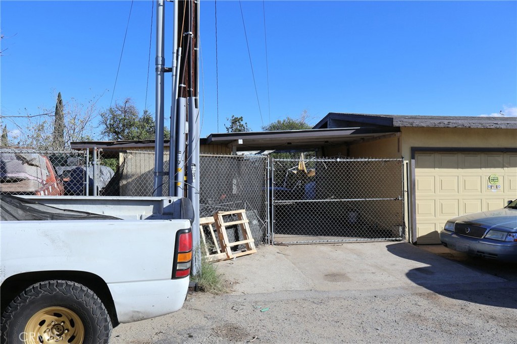 1261 North Rancho Avenue Colton, CA 92324 - Photo 4 of 27 a view of a car park in front of house