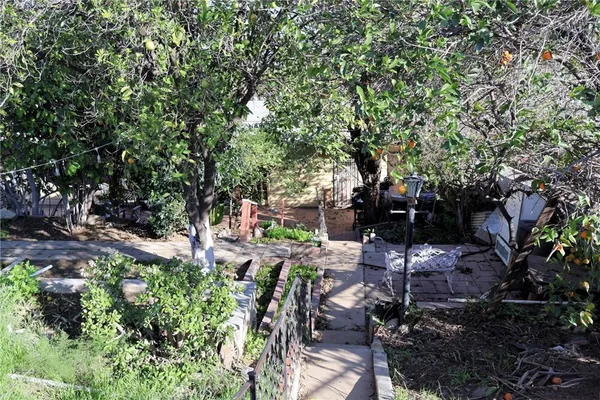 a view of backyard with sitting area