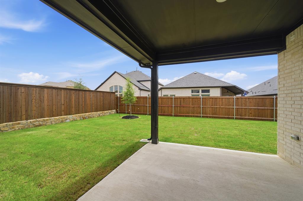 1908 Sangallo Lane Celina, TX 75009 - Photo 7 of 35 Covered outdoor patio with a concrete surface