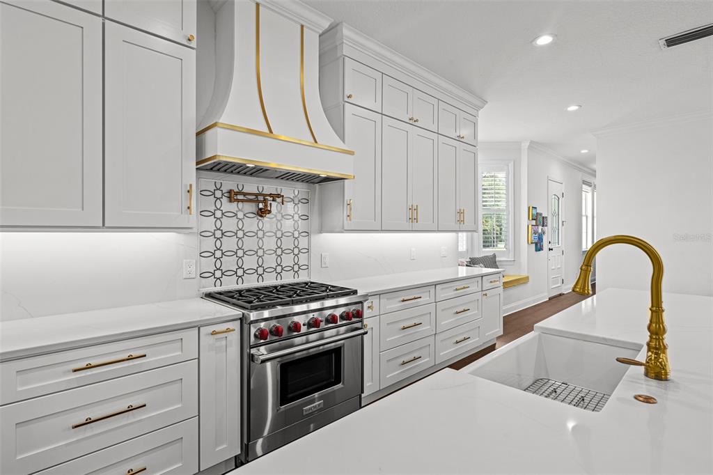11 Formosa Avenue Tampa, FL 33606 - Photo 13 of 53 a kitchen with granite countertop a stove and a sink