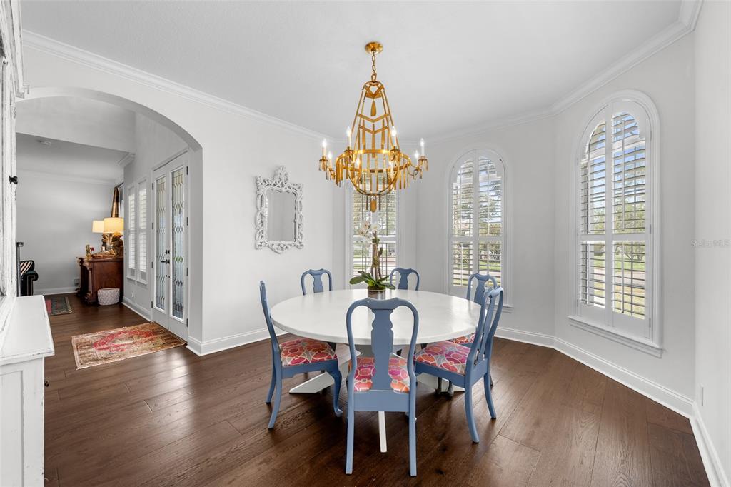 11 Formosa Avenue Tampa, FL 33606 - Photo 19 of 53 a view of a dining room with furniture wooden floor and chandelier