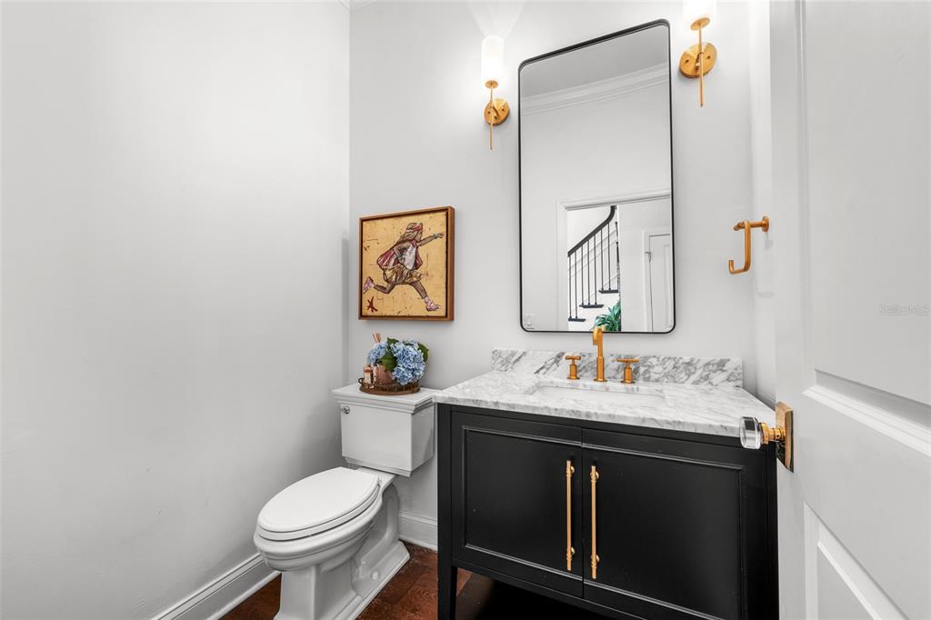 11 Formosa Avenue Tampa, FL 33606 - Photo 20 of 53 a bathroom with a sink toilet and mirror