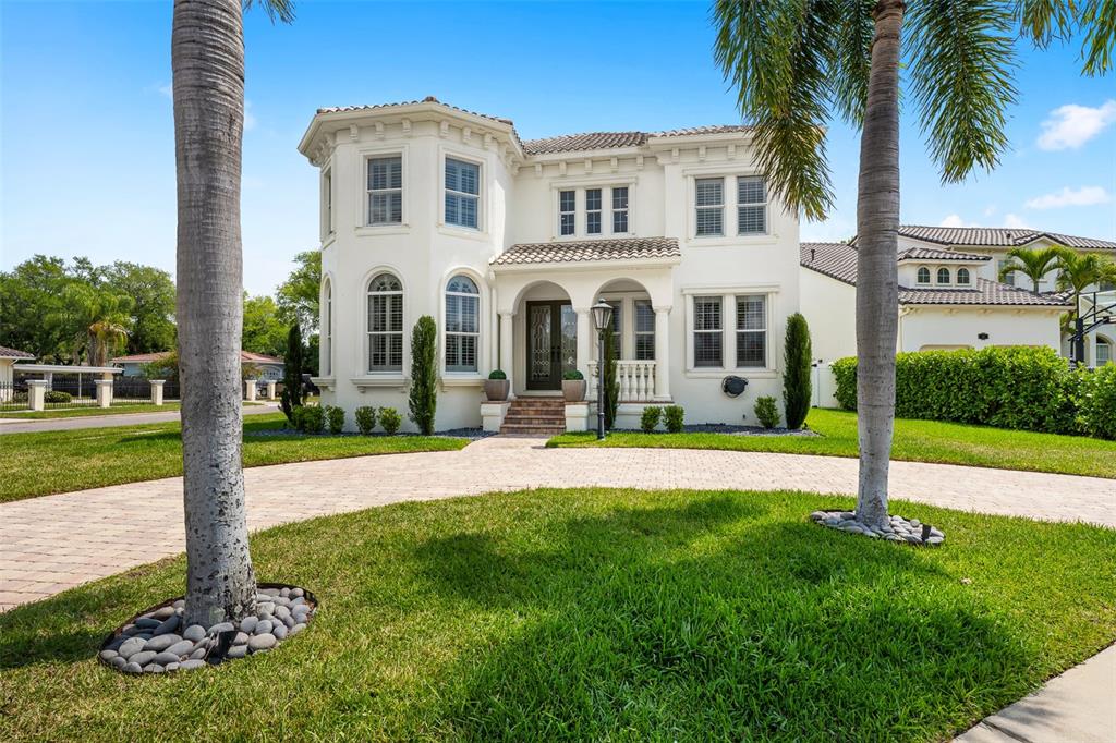 11 Formosa Avenue Tampa, FL 33606 - Photo 2 of 53 a front view of a house with swimming pool and garden