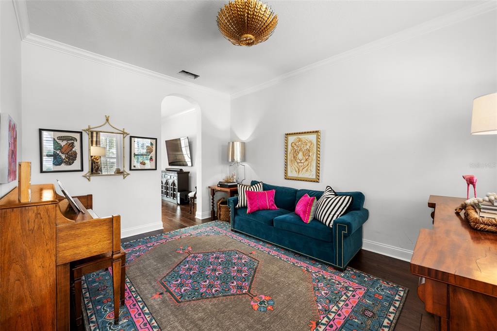 11 Formosa Avenue Tampa, FL 33606 - Photo 22 of 53 a living room with furniture and a wooden floor