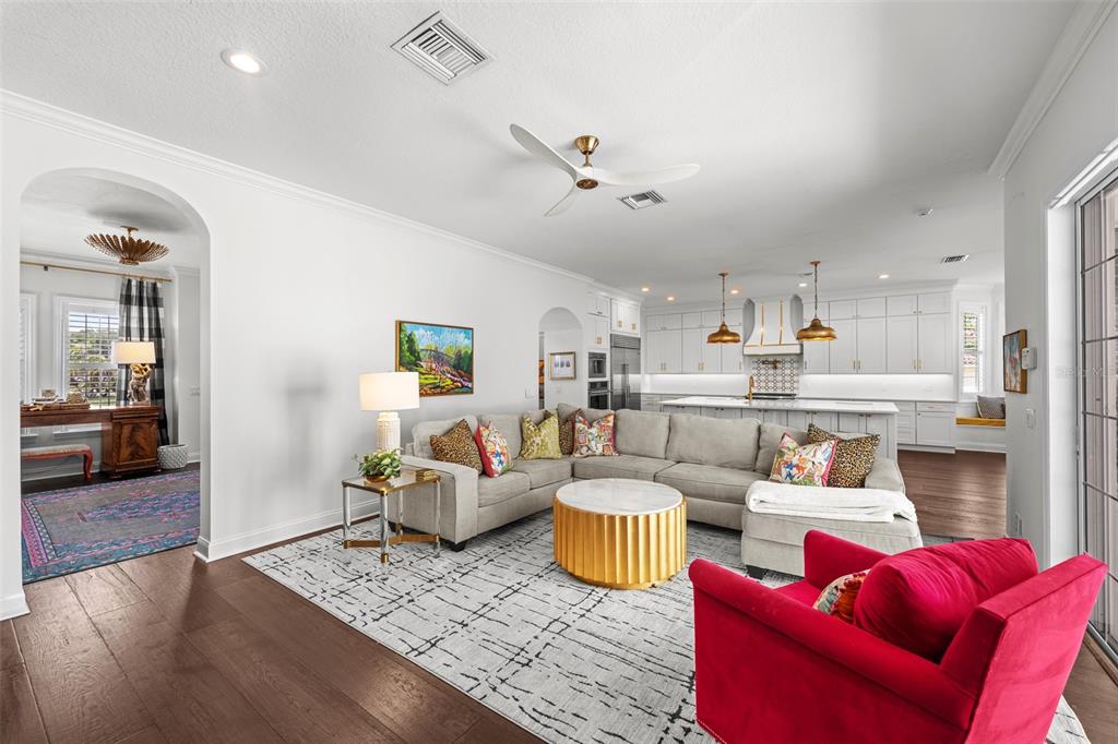 11 Formosa Avenue Tampa, FL 33606 - Photo 23 of 53 a living room with furniture kitchen view and a wooden floor