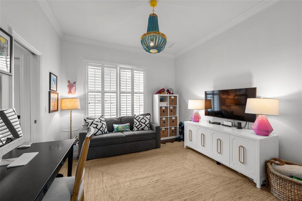 11 Formosa Avenue Tampa, FL 33606 - Photo 26 of 53 a bedroom with furniture and a flat screen tv
