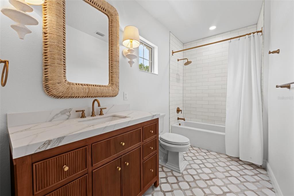 11 Formosa Avenue Tampa, FL 33606 - Photo 34 of 53 a bathroom with a granite countertop sink toilet and shower