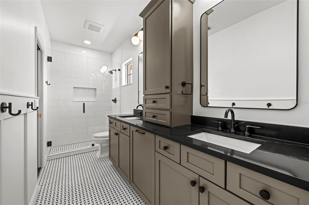 11 Formosa Avenue Tampa, FL 33606 - Photo 37 of 53 a bathroom with a double vanity sink and mirror