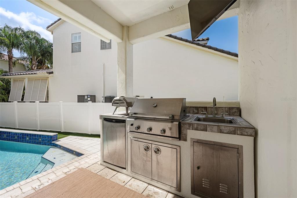 11 Formosa Avenue Tampa, FL 33606 - Photo 45 of 53 a kitchen with a stove top oven and cabinets