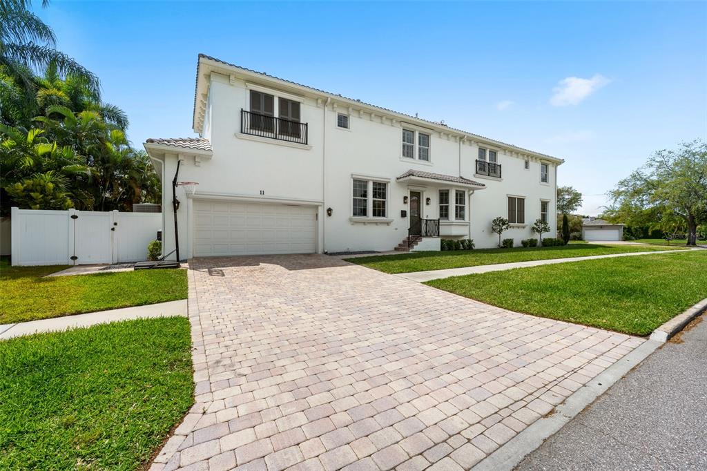 11 Formosa Avenue Tampa, FL 33606 - Photo 47 of 53 a front view of a house with a yard and trees