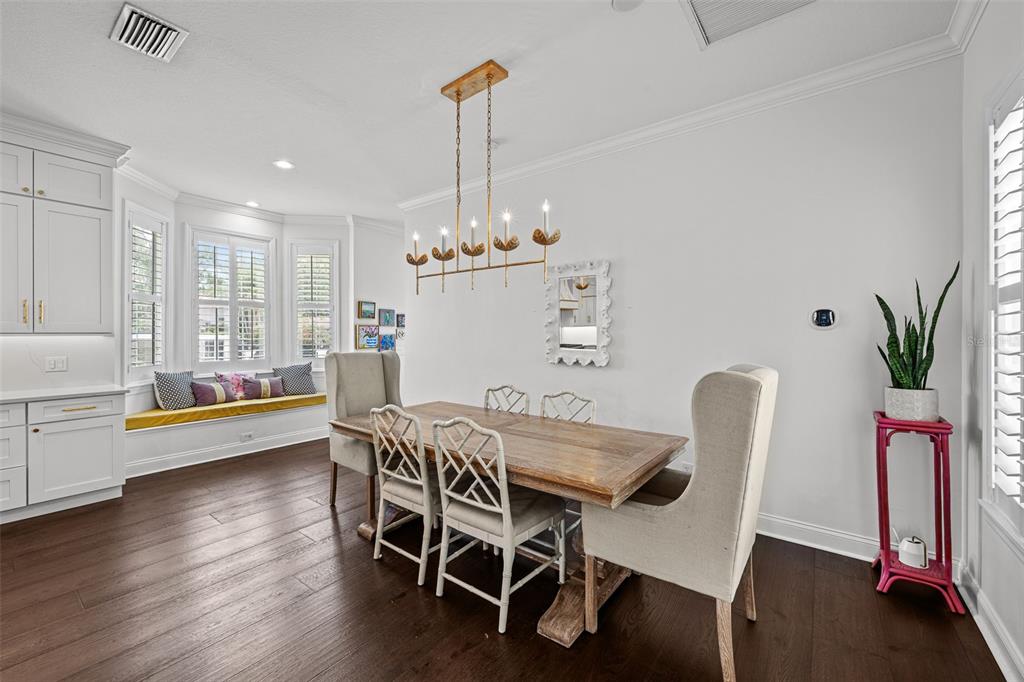 11 Formosa Avenue Tampa, FL 33606 - Photo 10 of 53 a dining room with furniture and wooden floor