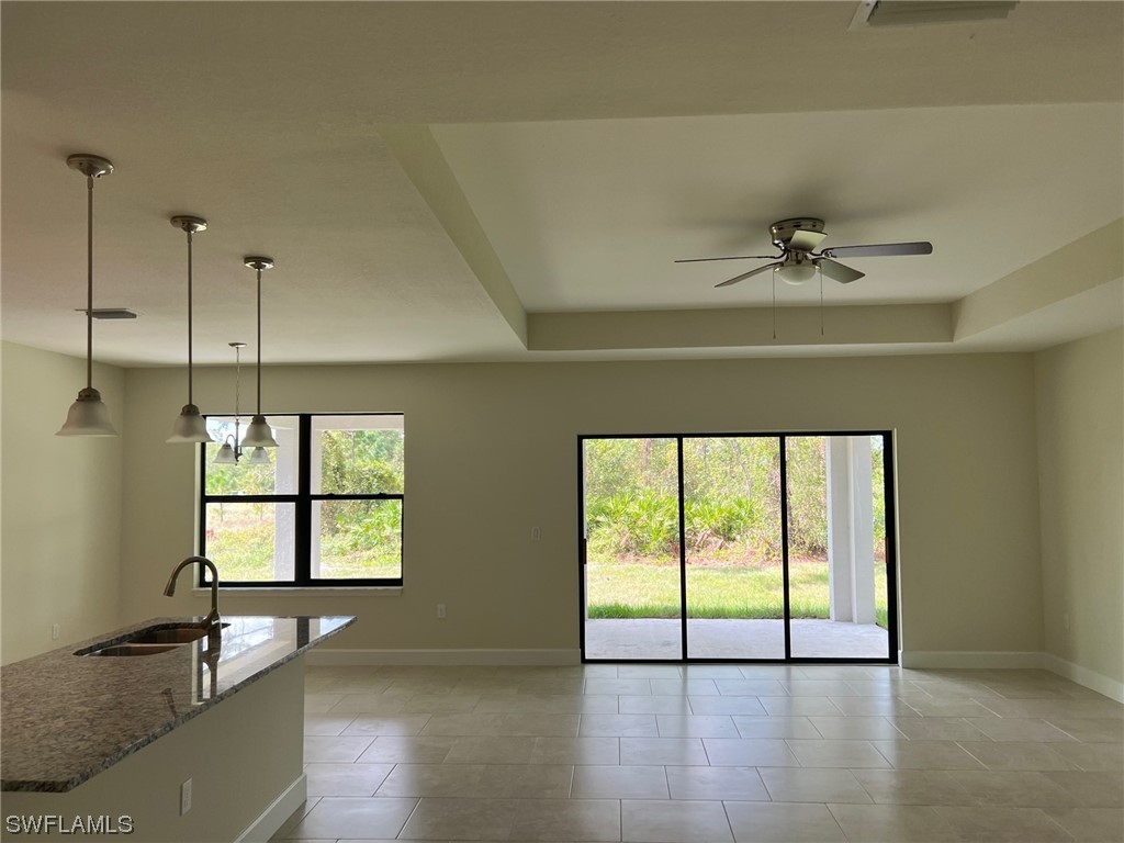 2615 27th Street West Lehigh Acres, FL 33971 - Photo 3 of 17 a view of an empty room with a window