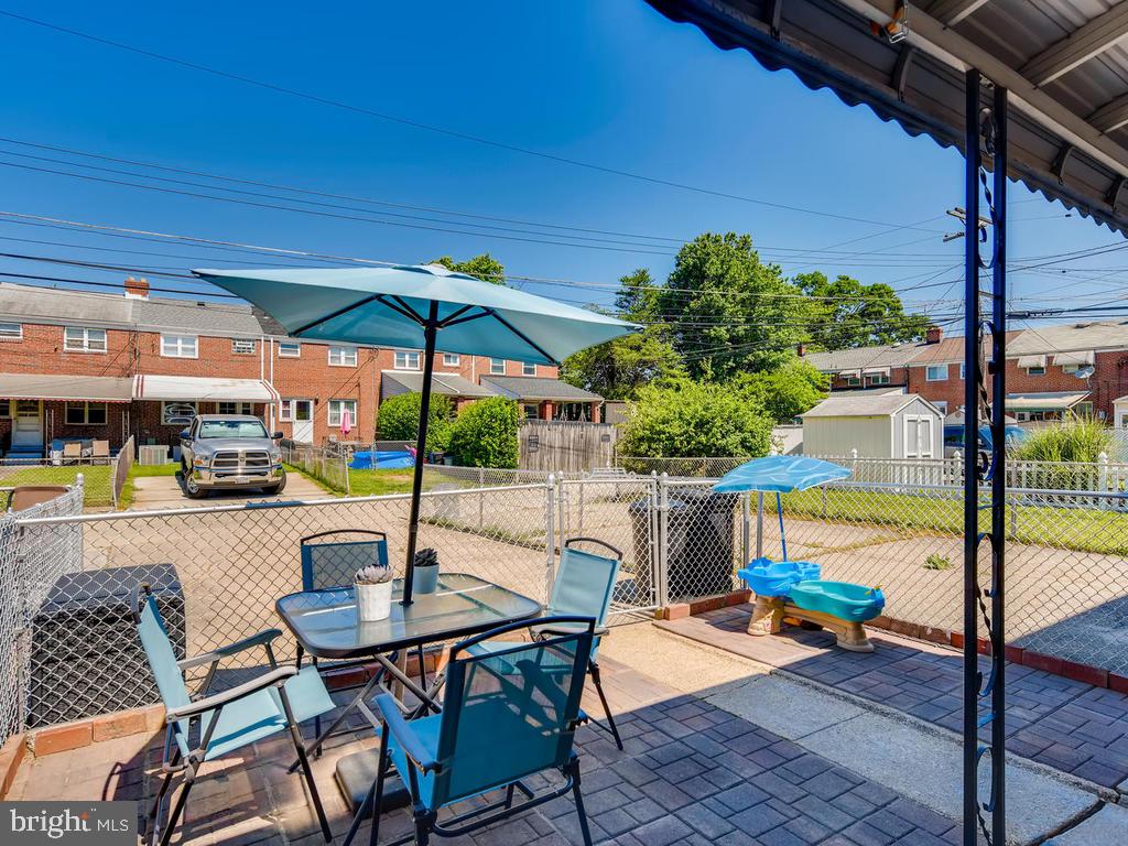 1906 Holborn Road Baltimore, MD 21222 - Photo 26 of 29 Fenced yard w/brick pavers & private parking pad!
