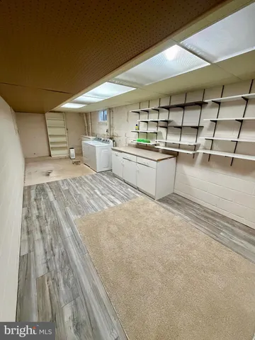 a view of a kitchen with furniture and window