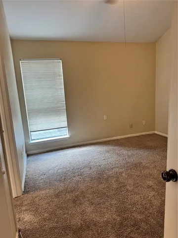 an empty room with a bench