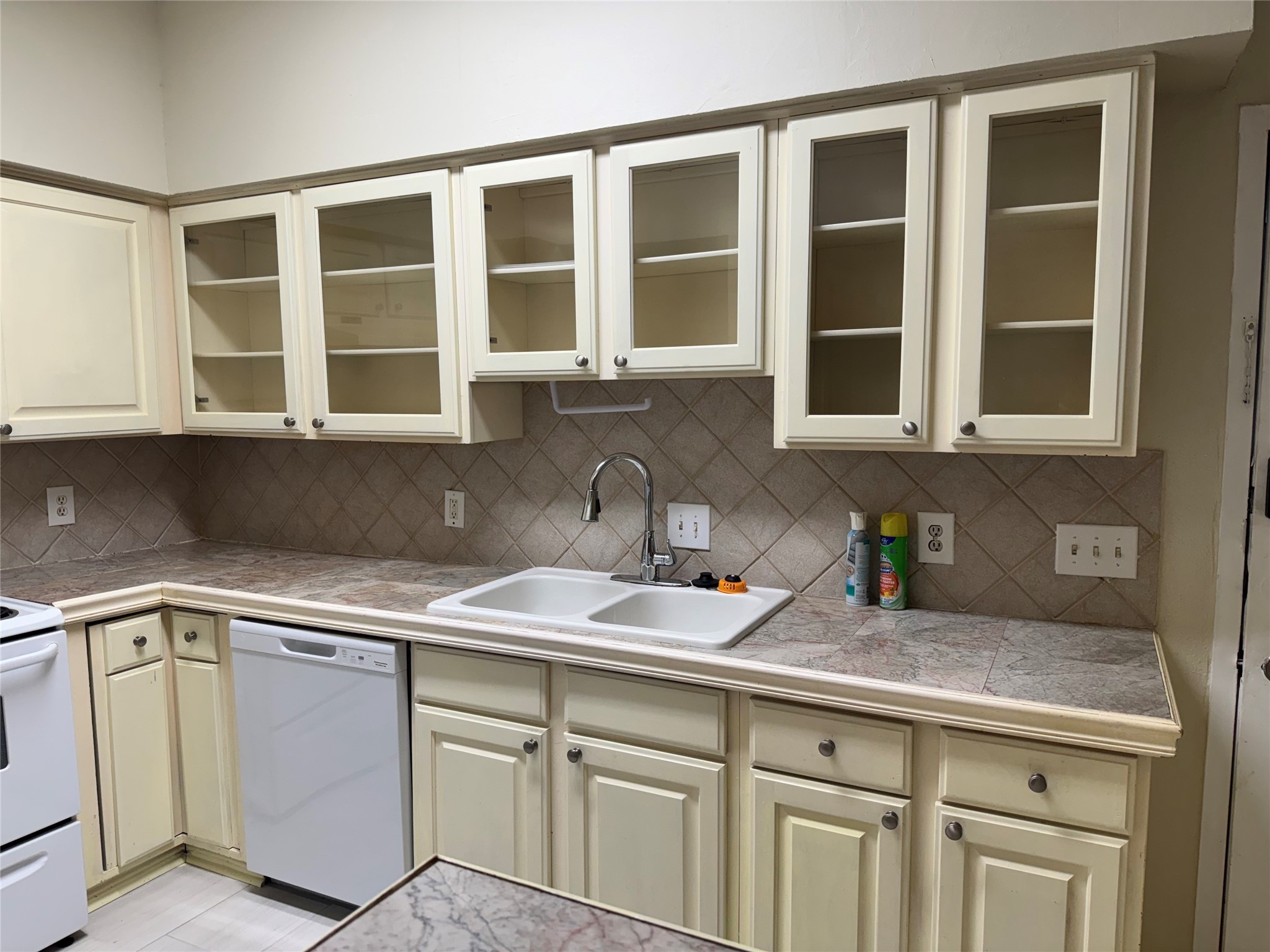 10811 Richmond Avenue, Unit 2 Houston, TX 77042 - Photo 3 of 23 a kitchen with stainless steel appliances granite countertop white cabinets and a sink