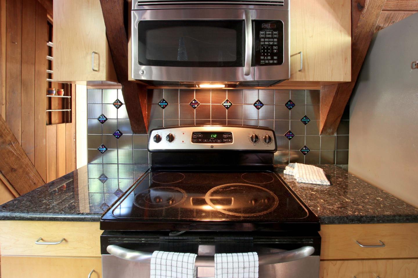 220 Shadowbrook Road Ben Lomond, CA 95005 - Photo 14 of 24 a stove top oven sitting inside of a kitchen