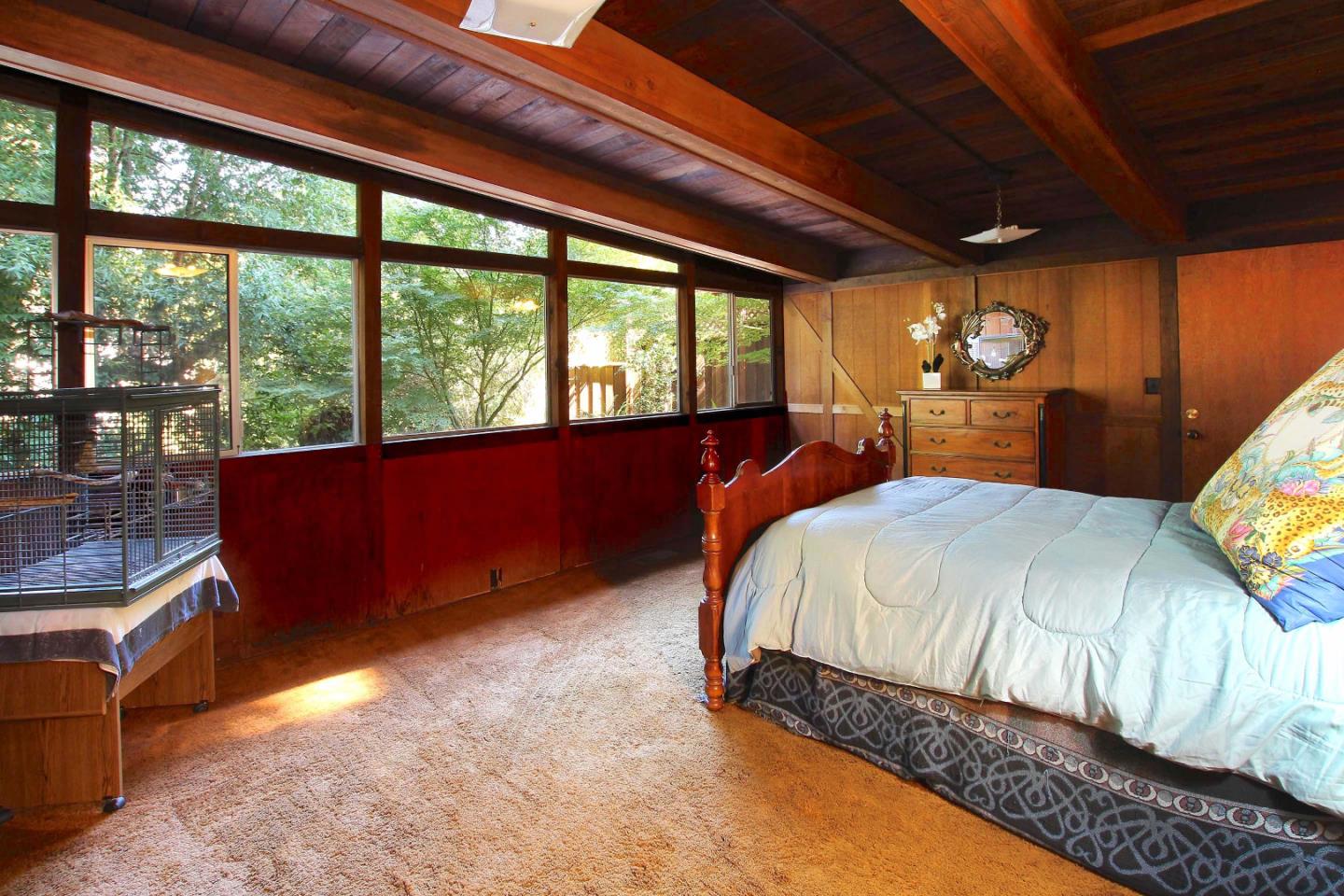 220 Shadowbrook Road Ben Lomond, CA 95005 - Photo 19 of 24 a bed sitting in a bedroom next to a window