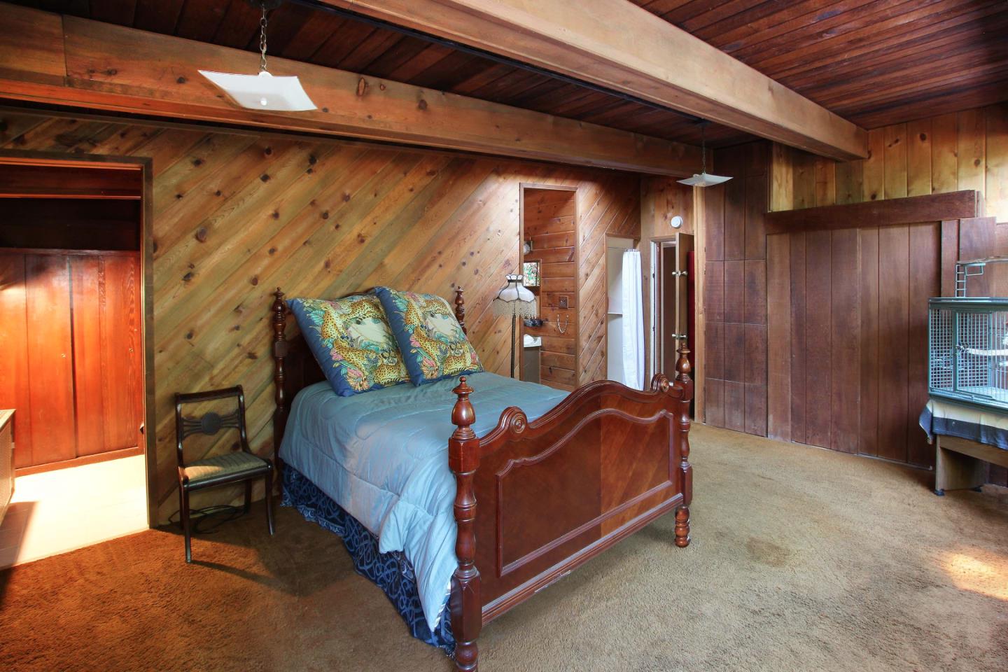 220 Shadowbrook Road Ben Lomond, CA 95005 - Photo 20 of 24 a bed sitting in a room next to a window