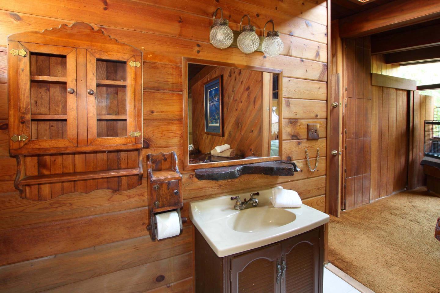 220 Shadowbrook Road Ben Lomond, CA 95005 - Photo 22 of 24 a bathroom with a sink and a mirror