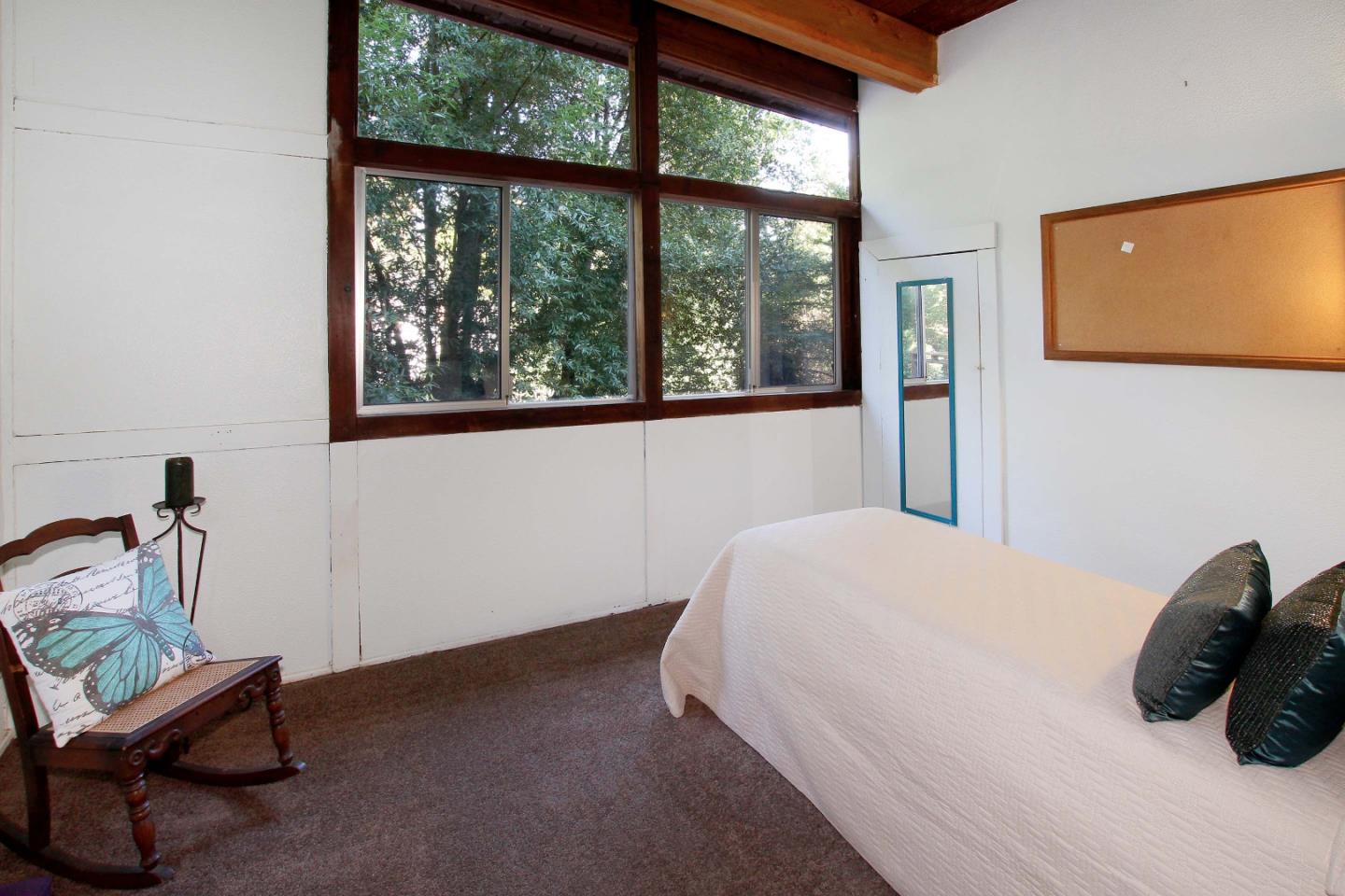 220 Shadowbrook Road Ben Lomond, CA 95005 - Photo 24 of 24 a bedroom with a bed and a window
