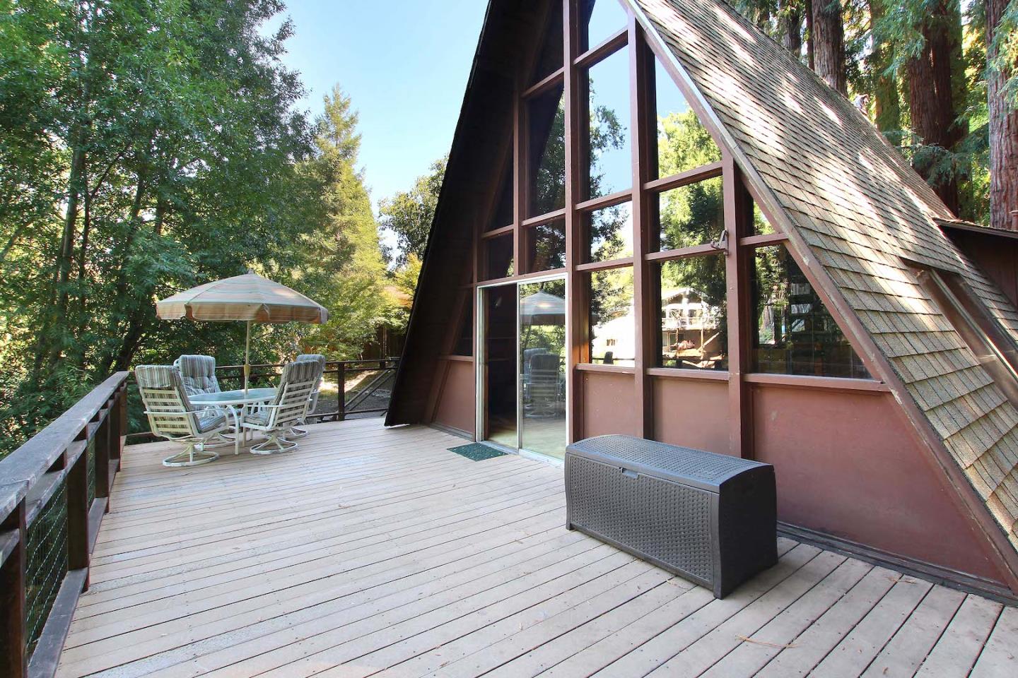 220 Shadowbrook Road Ben Lomond, CA 95005 - Photo 4 of 24 a view of a rooftop deck and dining room with furniture and wooden floor
